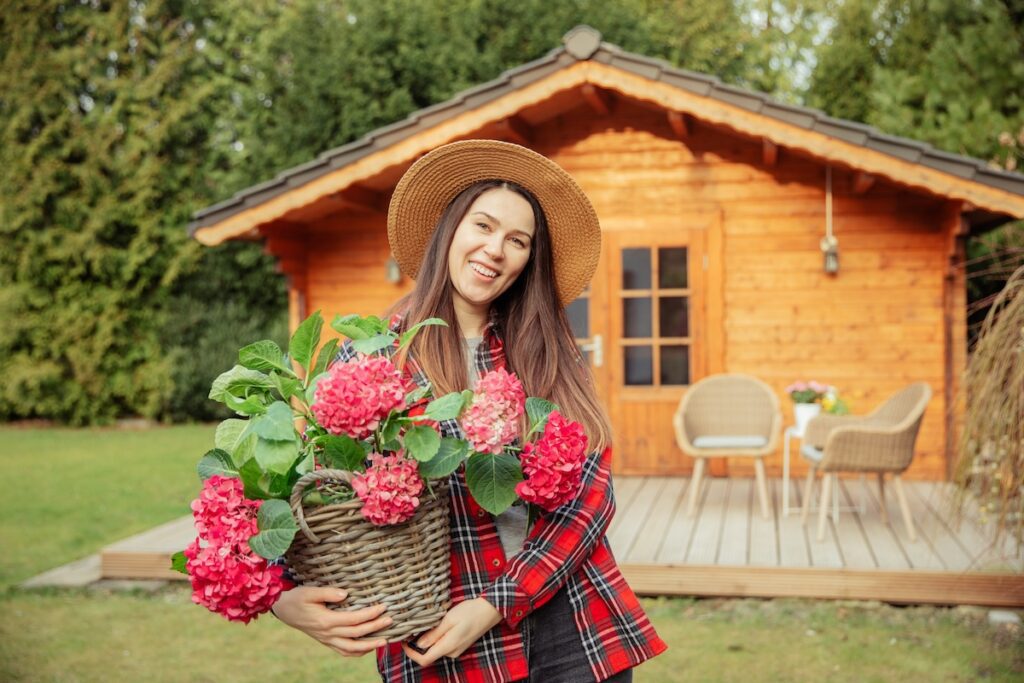 woman-garden-shed-flowers.jpg